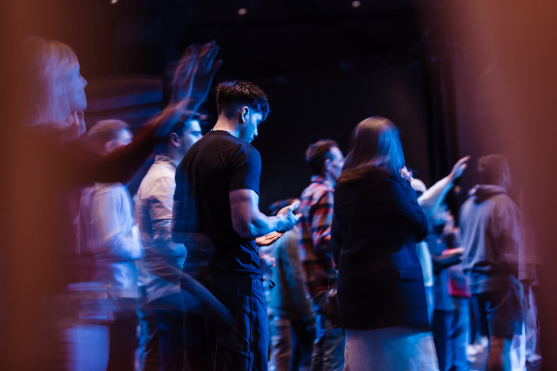 People praying at a prayer meeting