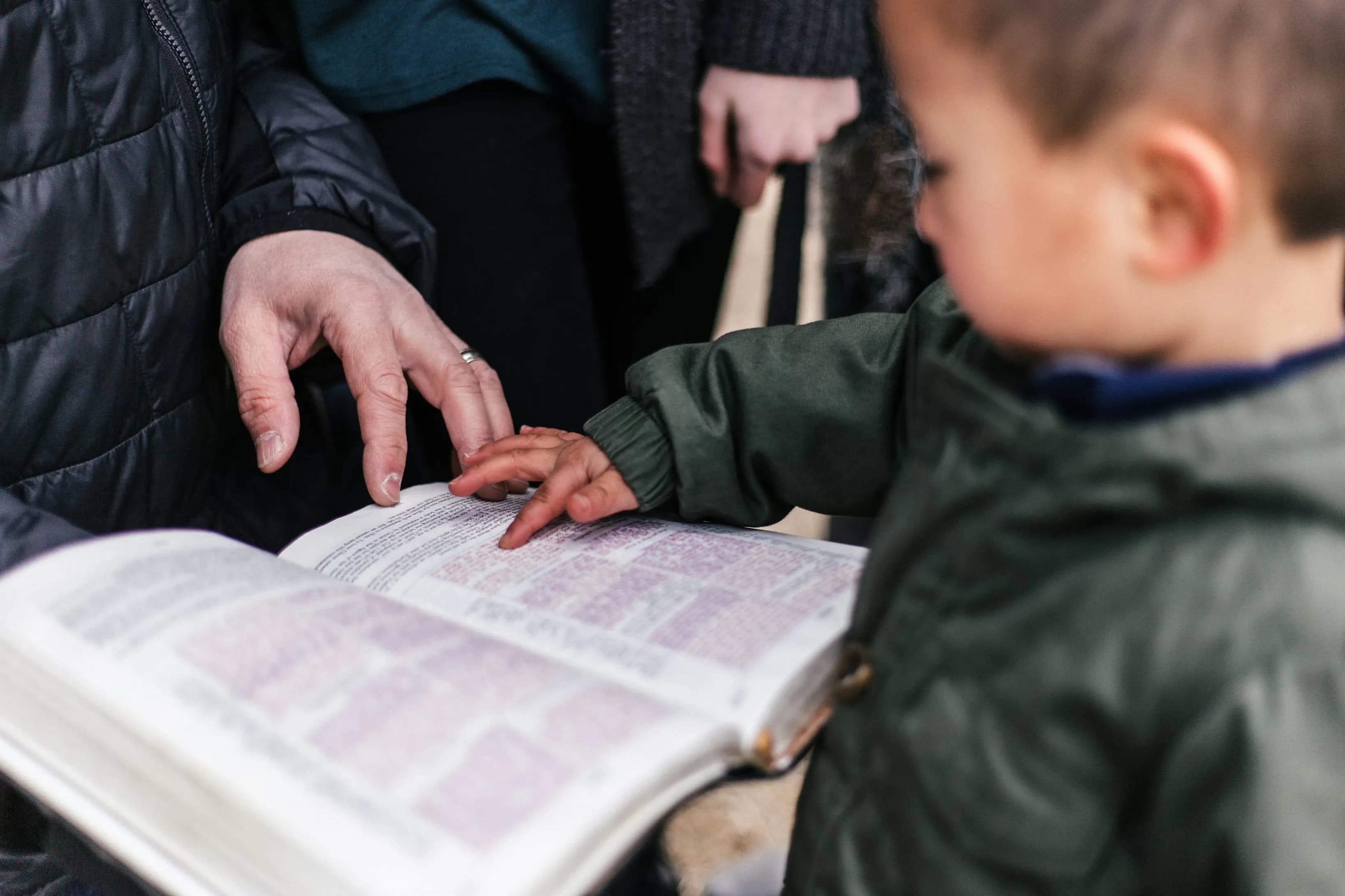 Boy touching bible