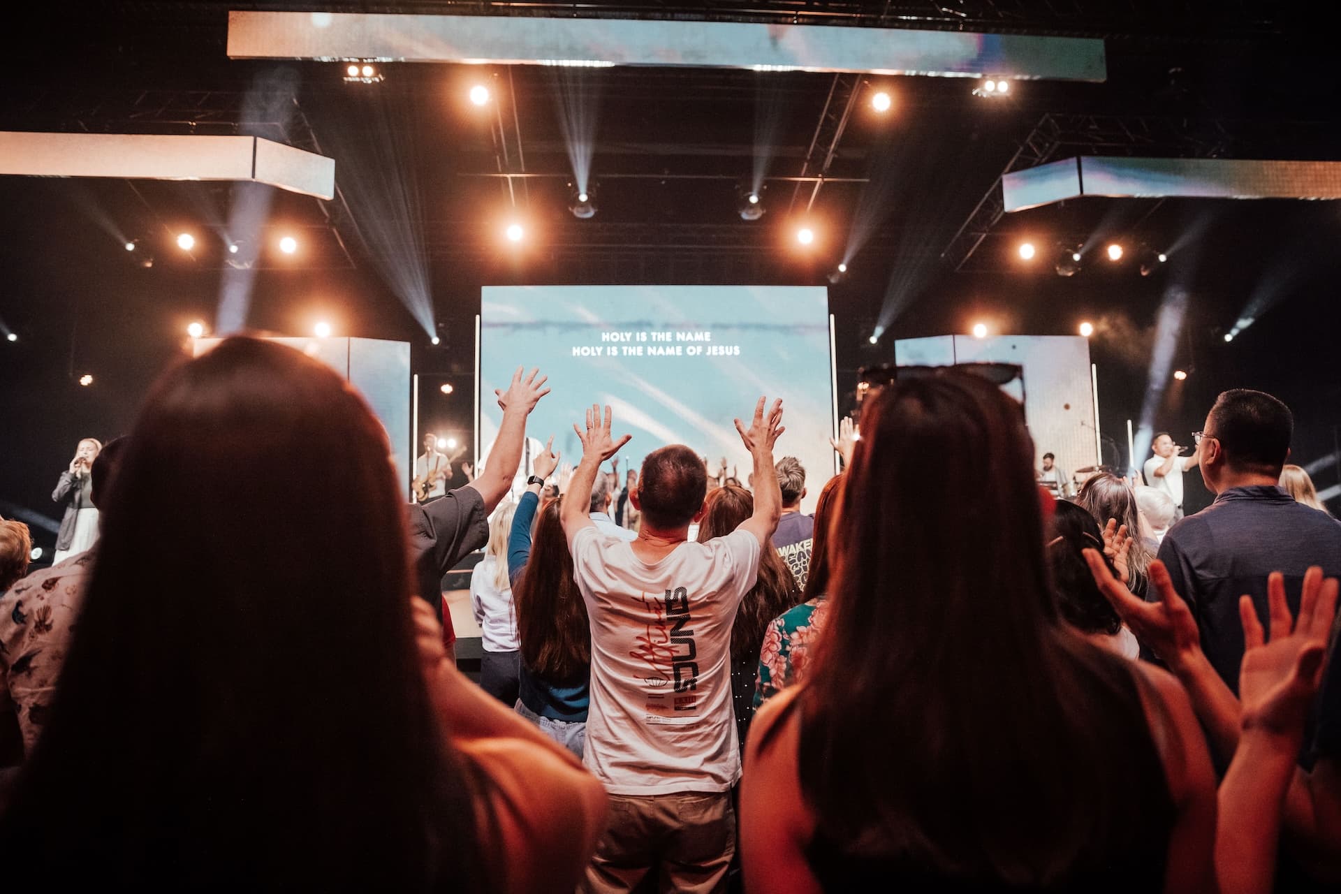 Person worshipping in the Central Auditorium