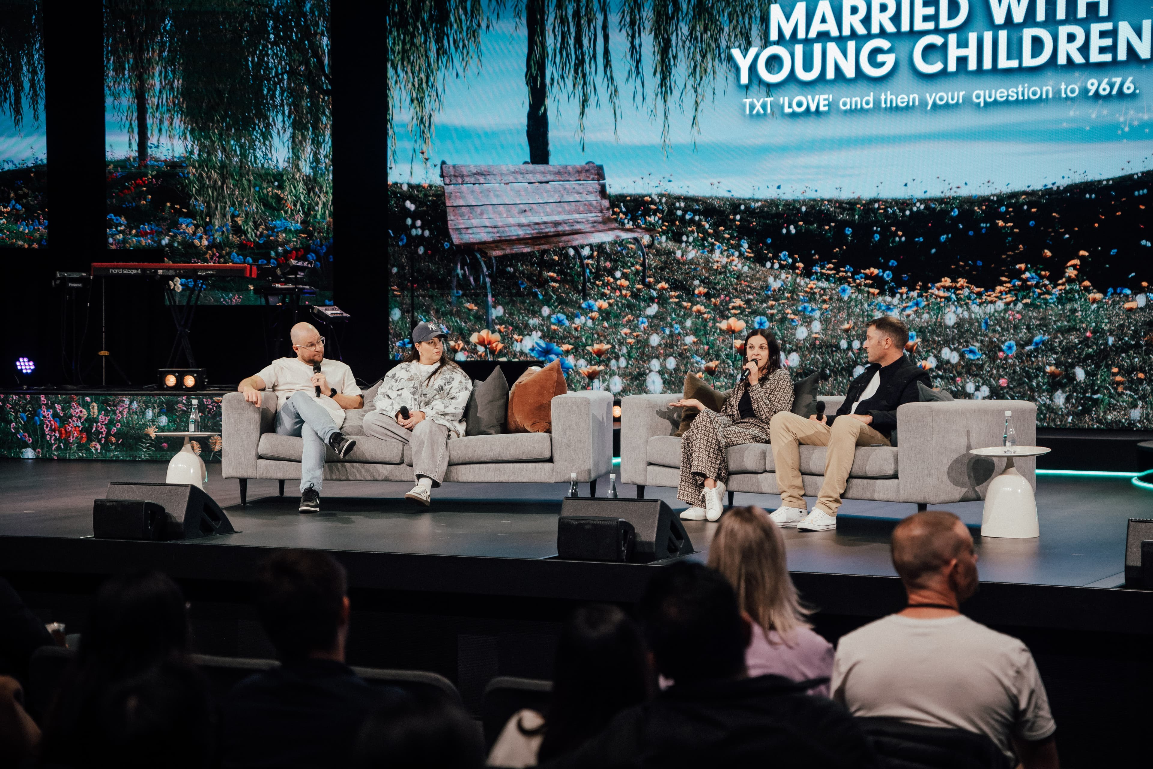 Two couples sitting on stage at Central Campus for relationship panel